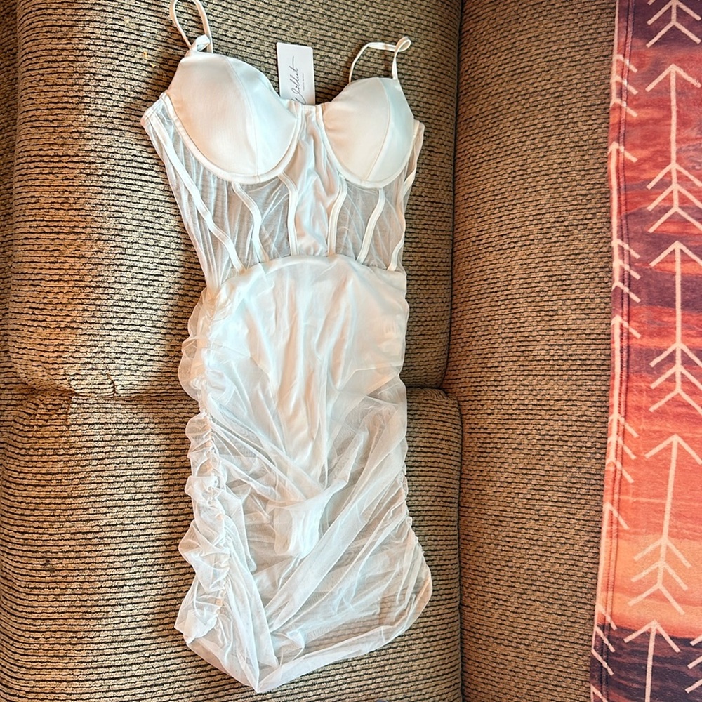 White spaghetti strap see-through midi dress. Comes with inner lining attached.